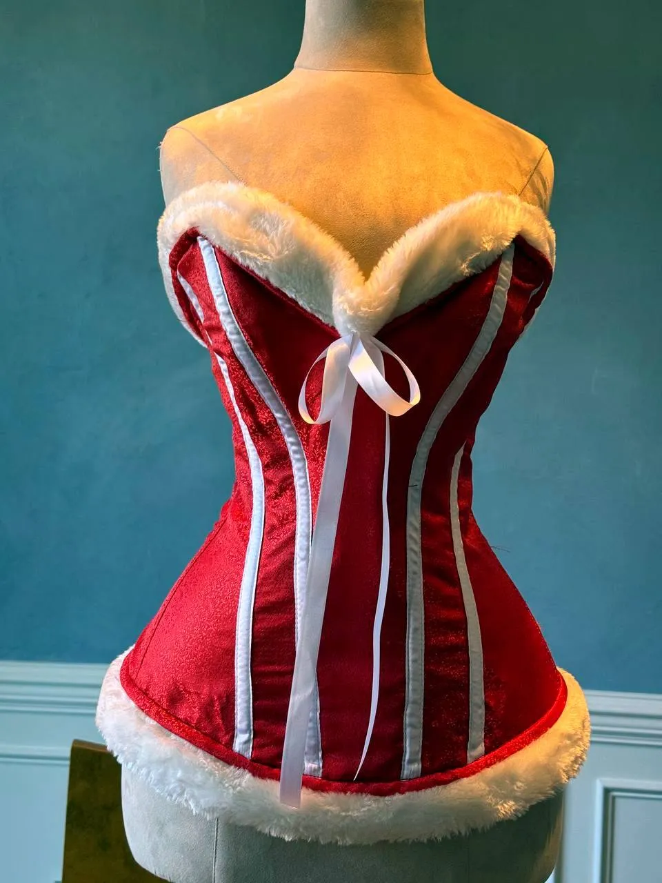 Red satin with white bones and fur affordable Santa Christmas corset. Corset is made personally according to your measurements.