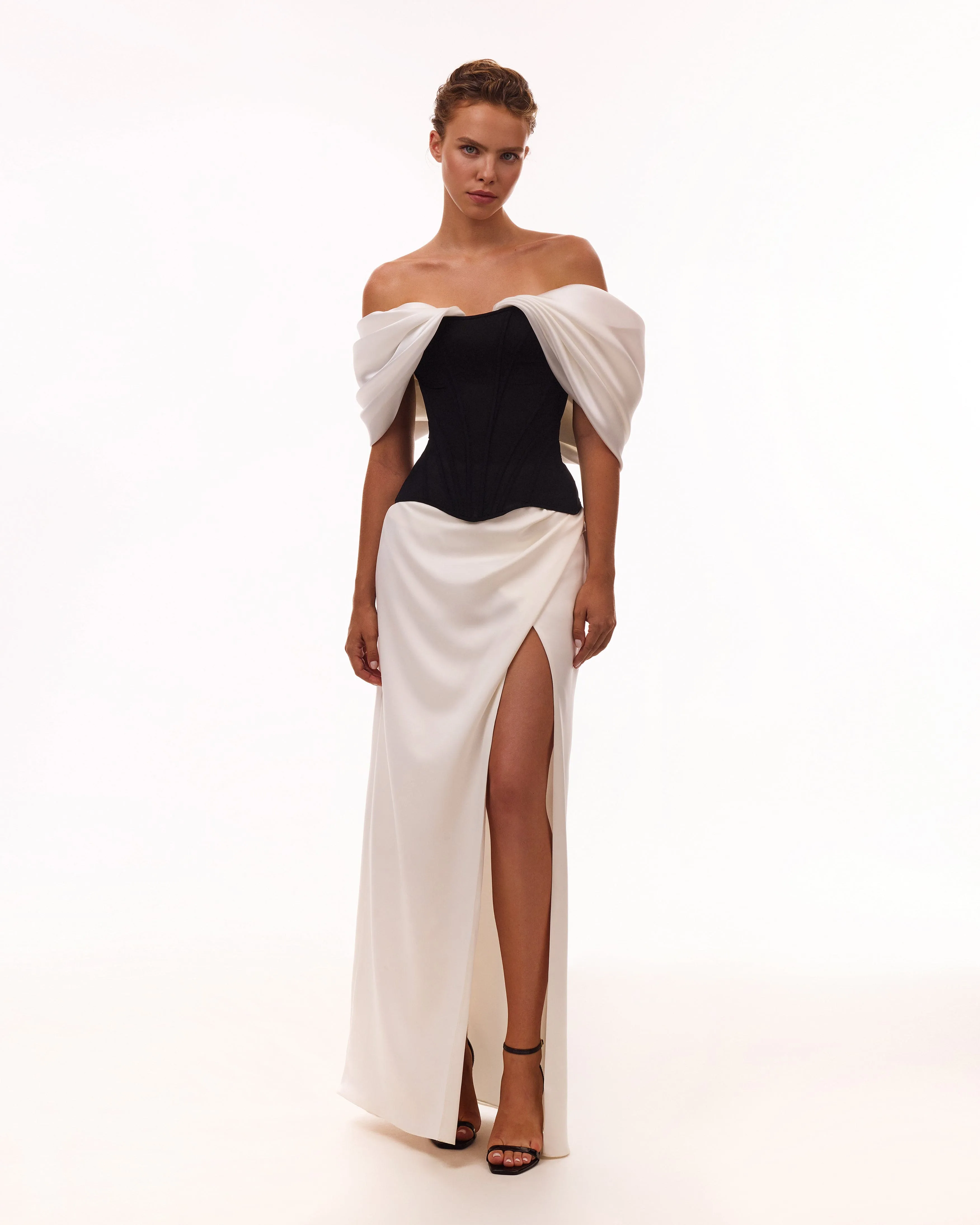 Sophisticated black fitted corset with white satin off-the-shoulder sleeves